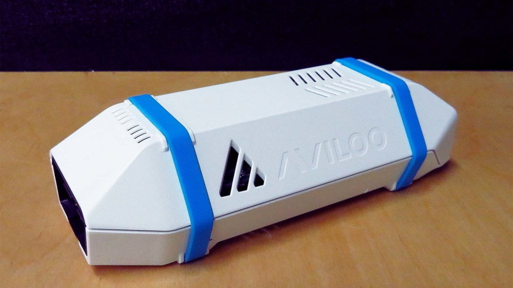 The AVILOO Box, A small white device with an OBD connection, LED indicator light and blue straps around it.