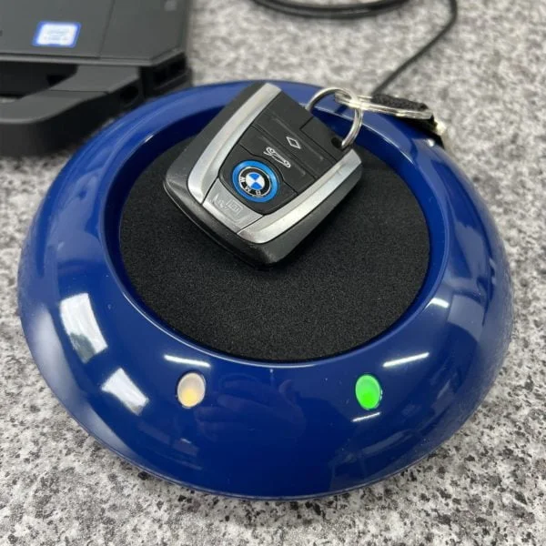 bmw desktop key reader on a worktop